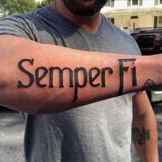 a man with a tattoo on his arm that says semper fi in black ink