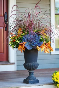 a large planter filled with lots of colorful flowers