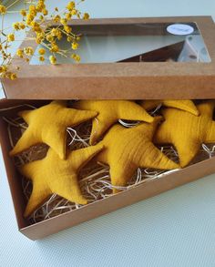 some yellow stars are in a cardboard box