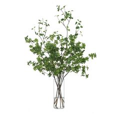 a vase filled with lots of green leaves