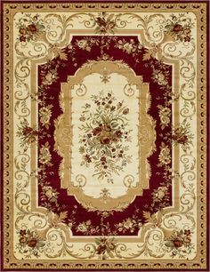 a red and beige rug with an ornate border