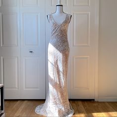 a dress on a mannequin in front of a door