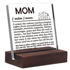 a wooden plaque with a poem on it that reads mom, woman / nourishment