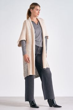 The Cliff 3/4 sleeve cardigan is a cozy must-have. Featuring a flattering knee-length silhouette, layer with any essential basic or jeans for a complete look. Designed with gorgeous color-blocking from front to back. Oversized Neutral Cardigan For Layering, Oversized Neutral Outerwear For Layering, Oversized Beige Sweater Coat For Layering, Neutral Cardigan For Fall Layering, Beige Outerwear For Layering, Neutral Knit Outerwear For Layering, Knit Outerwear In Neutral Color For Layering, Chic Beige Sweater Coat For Layering, Fall Outerwear For Layering With 3/4 Sleeve