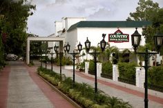 the country inn hotel and conference center is located at the end of a brick walkway