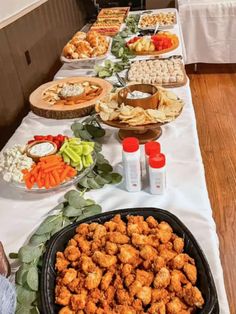 a buffet table filled with different types of food