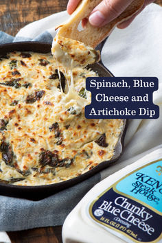 spinach, blue cheese and artichoke dip in a cast iron skillet