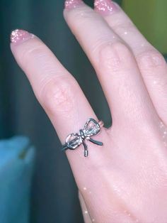 𝔇𝔢𝔱𝔞𝔦𝔩𝔰 Style: Y2k, Coquette, Kawaii Materials: Metal Quantity: 2 pcs(set) Elevate your style with our Coquette Basic Ribbon Rings Set - an embodiment of simple yet classic beauty. Whether it's a casual day out or a special occasion, these cute ribbon rings effortlessly enhance your look with their delicate design. Enjoy free shipping with a purchase of over 80$ Adjustable Silver Alloy Rings, Adjustable Alloy Promise Ring, Alloy Rings Suitable For Gifts, Alloy Open Ring Jewelry For Gifts, Alloy Open Ring Jewelry Gift, Silver Alloy Wedding Rings, Silver Alloy Promise Ring, Silver Alloy Rings As Gifts, Cute Jewelry With Butterfly Knot For Gifts