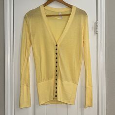 Yellow Button Down Cardigan. Nwot. Never Worn. Super Pretty Butter Yellow In Color. Fitted Cardigan Spring Snap Button Button-up Cardigan, Spring Button-up Cardigan With Snap Buttons, Spring Snap Button Cardigan, Cotton Button-up Cardigan For Day Out, Cotton Cardigan With Buttons For Day Out, Spring Everyday Cardigan With Buttons, Spring Yellow Cardigan With Buttons, Spring Yellow Buttoned Cardigan, Yellow Button Sweater For Spring