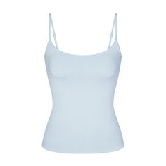 Getting dressed is smoother in SKIMS. Made with our buttery-sleek fabric that smooths and hugs your body, this lightly supportive tank flatters your figure and levels up your off-duty comfort. Features a shelf bra with underbust elastic for light bust support, a scoop neck, and adjustable straps. Hits below the natural waist. Fits true to size. Viral Clothes 2024, Cute Clothing Pieces, Light Blue Spaghetti Strap Top, Cute Blue Tops, Stockholm Clothes, Light Blue Tank Top, Simple Clothes, Cheap Clothing Websites, Clothes Wishlist