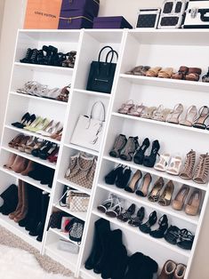 a white shelf filled with lots of shoes and handbags