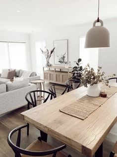 a wooden table sitting in the middle of a living room