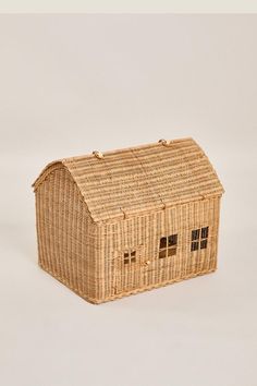 a house made out of wicker sitting on top of a table