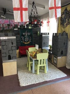 a table and chairs in a room with flags