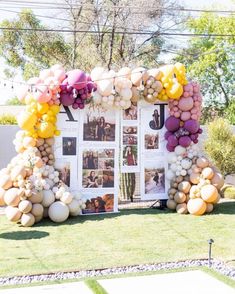 an arch made out of balloons and photos