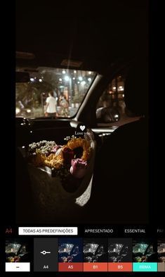 the interior of a car at night with people in the back seat and onlookers