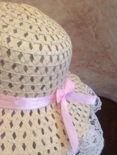 This is a beige straw hat trimmed in white lace with light pink satin ribbon and lovely pink flower. This hat fits smaller girls 18-20.5 inches head circumference. Spring Cream Hat With Ribbon, Spring Crochet Cloche Hat, Adjustable Pink Hat With Ribbon, Pink Adjustable Hat With Ribbon, Pink Adjustable Ribbon Hat, Spring Garden Party Hat With Ribbon, Spring Straw Hat With Ribbon For Garden Party, Straw Hat With Ribbon For Spring Garden Party, Spring Beige Hat With Ribbon