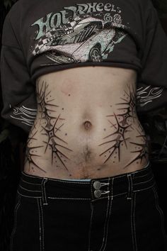 a man with tattoos on his stomach