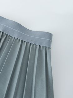 This Pleated Skirt in Slate Blue features a flattering 37 inch length. The pleated design adds dimension to your look, while the rich color adds a touch of sophistication. Solid Color Stretch Mini Pleated Skirt, Solid Chic Pleated Skirt, Flowy Skirt With Accordion Pleats In Solid Color, Chic Pleated Skirt With Folds, Solid Bottoms With Folds For Spring, Chic Blue Accordion Pleated Skirt, Spring Bottoms With Folds, Chic Blue Skirt With Accordion Pleats, Solid Pleated Skirt With Stretch