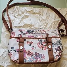 Small Bag With Flowers And Soft Brown Leather Straps. Has Multiple Pockets. Never Used Beige Floral Print Shoulder Bag For Everyday Use, Beige Floral Print Satchel Shoulder Bag, Beige Floral Print Crossbody Shoulder Bag, Cream Crossbody Satchel For Spring, Spring Floral Print Cream Bags, Everyday White Shoulder Bag With Floral Print, White Floral Print Satchel Shoulder Bag, White Floral Print Shoulder Bag For Everyday Use, Everyday White Floral Print Shoulder Bag