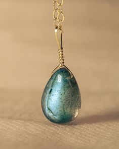 Our most classic style, this minimalist and dainty necklace is perfect for every day wear. Labradorite is a mystical and protective stone, imparting strength and perseverance in times of change. This gemstone gives off a blue flash called labradorescence which depicts the labradorite spiritual meaning of transformation and growth. This handcrafted necklaces and pendants are wrapped in 14k gold-filled. Durable Jewelry | Pendant | Gold Necklace | Durable Jewelry | Fashion & Accesories Teardrop Pendant Jewelry With Natural Inclusions For Healing, Wire Wrapped Labradorite Teardrop Pendant Necklace, Spiritual Labradorite Jewelry With Natural Inclusions, Green Labradorite Teardrop Jewelry, Labradorite Drop Jewelry For Gift, Handmade Labradorite Drop Necklaces, Handmade Drop-shaped Labradorite Necklaces, Handmade Labradorite Drop Necklace, Spiritual Green Labradorite Necklaces