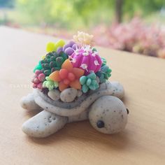 there is a small turtle made out of beads