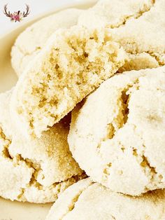 a plate full of sugar cookies on top of a table