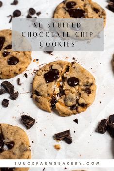 two chocolate chip cookies on top of white paper with text overlay that reads x - stuffed choc chip cookies