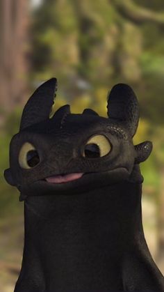 an animated black dragon with big eyes and ears, standing in front of a wooded area