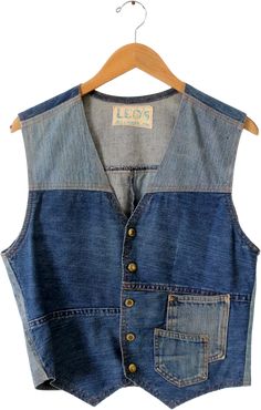 This is a vintage custom denim vest. The hand-crafted vest features a patchwork of denim tones with two overlapping pockets on the front. It buttons closed with a v-neckline. CONDITIONIn good condition with wear consistent with age and use. APPROXIMATE FIT : Men's M or Women's LMEASUREMENTSBust: 38" .. 96.5 cmLength: 20.25" .. 51.4 cmShoulders: 15.5" .. 39.4 cmWaist: 34" .. 86.4 cm52143Women’s blue, vest. Very Good condition, size L (10 - 12) and M (6 - 8). Detailed measurements:Bust - 38 inches Vest Patchwork, Denim Vest Outfit, Blue Jean Vest, Ugly Outfits, Patchwork Vest, Outfits 70s, Denim Vests, Blue Vest, Custom Denim