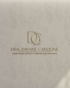 the logo for dra davane caroline is shown in gold on a white background