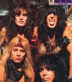 the band kiss posing for a photo together