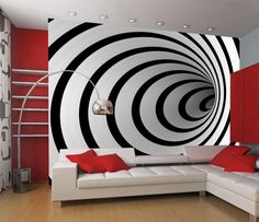 a modern living room with red and white walls, black and white circles on the wall