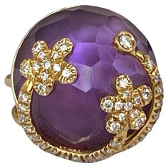 This ring is beyond stunningly beautiful and made of 18 kt Yellow Gold. Fantasy shape amethyst stone decorated with garlands of high quality diamonds approx. 0.65 ct G/VS/SI. The ring has stamps and numbered. Weight of the ring: 15.8 gram High of the ring is 20mm Sizes of the ring: 16.50 mm 6 USA size ( can be resized) Fine Jewelry Yellow Gold Diamond Amethyst Ring, Fine Jewelry Yellow Gold Amethyst Diamond Ring, Yellow Gold Amethyst Diamond Ring, Luxury Amethyst Ring With Diamond Accents For Anniversary, Luxury Amethyst Diamond Ring For Gift, Dazzling Amethyst Diamond Ring, Exquisite Purple Diamond Rings, Luxury Diamond Ring With Amethyst Accent Stones, Luxury Amethyst Diamond Ring With Accent Stones