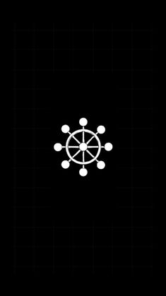 a black and white photo with an image of a compass in the center, on a dark background