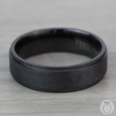 This black titanium Men's band is 7 millimeters wide and features a unique pattern flanked by high polished beveled edges. Comfort-Fit and proudly made in the USA. Black Titanium Round Jewelry, Black Titanium Anniversary Rings, Wide Wedding Bands, Mens Wedding Ring, Titanium Wedding Rings, Mens Rings, Wedding Speech, Men's Wedding Ring, Titanium Rings