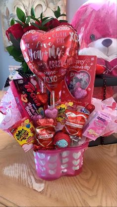 valentine's day gift basket with heart shaped balloon and candy