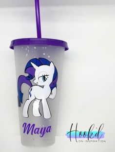 the cup has a purple lid and is decorated with an image of a pony on it