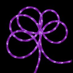 purple light up ribbon on black background with circles in the shape of a four - leaf clover