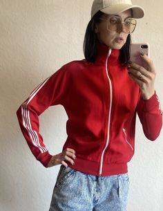 Lovely unisex athletic sports jacket from 1970s by Sports Master. The sweatshirt tight fit. Main colour is beautiful deep red and it has white stripes on sleeves and shoulders. Full zip closing. One pocket with zipper closing. High roll up collar. The fabric is 45 cotton and 55% nylon. Estimated current size : EU 34-38 US 2-6 UK 6-10 The model on the photos is 174 cm tall; bust 86 cm, waist 66 cm, hips 89 cm (EU 34-36). NB! FOR EXPRESS DELIVERY WITH DHL I NEED YOUR E-MAIL ADDRESS AND PHONE NUMBE Athletic Sports, Sports Jacket, White Stripe, Sweat Shirt, Favorite Outfit, Gender Neutral, Tights, Bathing Beauties, Cotton Blend