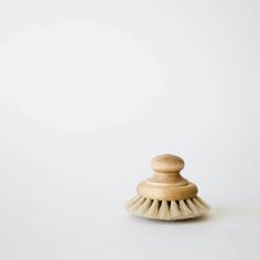 a wooden brush on a white background