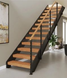 a stair case with wooden treads in a living room next to a painting on the wall