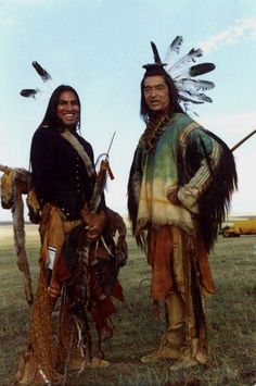 two native american indians standing next to each other