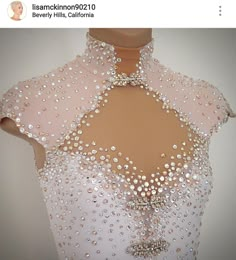 a dress with sequins and pearls on it