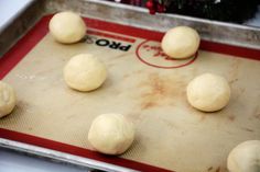 dough balls on a baking sheet ready to go into the oven for making christmas cookies