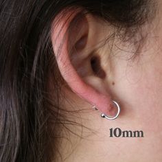 1 Pair Ball Hoop Earring Sterling Silver Hoop Post Earrings NO RETURNS ON EARRINGS - for sanitation reasons ✦ Quantity: 2 pieces (1 pair) Includes backings ✦ Material: sterling silver ✦ Dimensions: 19mm (1.3mm thick) or 10mm (1mm thick) ✦ Surface: shiny silver ** Please note that not all charms will slide onto these hoops. You may need jump rings to attach the charm to the hoops. If you have any questions about if a charm can slide, please send a message and I'll let you know! Jump rings: https: Earrings Silver Hoops, Tiny Gold Earrings, Earring Wires, Earring Hook, Large Earrings, Wire Earrings, Sterling Silver Hoops, Gold Hoops, Shiny Silver