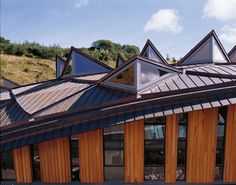 the roof of a building that has wooden shingles on it and is made from wood