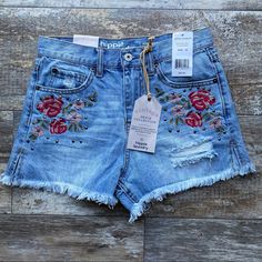 These Cute Embroidered Floral Distressed Denim Shorts Are Perfect For Any Occasion! Pair It With A Pair Of Sandals Or Your Favorite Boots. - Waist Approx. 12.5” - Inseam Approx. 2.5” - Rise Approx. 10” Medium Wash Short Jeans With Floral Embroidery, Medium Wash Floral Embroidered Short Jeans, Medium Wash Floral Embroidery Short Jeans, Embroidered High Rise Denim Shorts, High-rise Embroidered Denim Shorts, High Rise Denim Bottoms With Floral Embroidery, High-rise Denim Bottoms With Floral Embroidery, Medium Wash Denim Shorts With Floral Embroidery, Denim Shorts With Floral Embroidery In Medium Wash