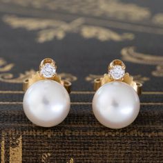 These sweet diamond and pearl stud earrings are such a sweet and classic duo, a perfect daily earring, or even a bridal moment! Pearl studs are having a moment right now, and we love that these incorporate a little diamond sparkle at the posts. They're also from T&Co - an added bonus if you ask us! 18kt yellow gold Diamonds are estimated to be G/H colors & VVS clarities. GIA standards Please see qualitative report for more information. Diamond Earrings For Gifts, Elegant Timeless Earrings For Anniversary, Timeless Yellow Gold Bridal Earrings For Anniversary, Elegant Diamond Earrings With Timeless Design, Elegant Timeless Diamond Earrings For Anniversary, Luxury Pearl Earrings With Diamond Accents For Wedding, Elegant Earrings With Timeless Design As Gift, Luxury Wedding Pearl Earrings With Diamond Accents, Timeless Design Round Earrings For Gift