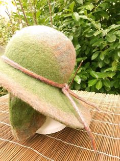 Green felted wool hat with wide brim Handmade by Estambul Atelier. Materials: 100% natural and organic Merino wool. Adult - one size. **Made to Order** There may be a slight design/ colour variance compared to the images as each piece is hand made to order. Made with the wet felting technique using warm water and pure olive oil soap to blend the natural fibres into a strong and breathable fabric. I recommend hand washing, but can be machine washed using the wool/ delicate setting at a cool tempe Classic Adjustable Green Felt Hat, Green Felt Hat, Green Wool Brimmed Hat, Green Cotton 5-panel Hat, Green Wool Cap, Olive Oil Soap, Natural Fibres, Wool Hat, Felted Wool